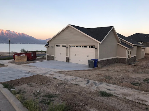 Residential construction site with house plans and tools symbolizing pre-build decisions | Right High-End Home Builder | Luxury Home Builder Differences | Build a Custom Home